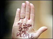 The palm of Rosie Kane, MSP on which is written 'MY OATH IS TO THE PEOPLE' in protest at the requirement that MSPs pledge allegiance to the monarch